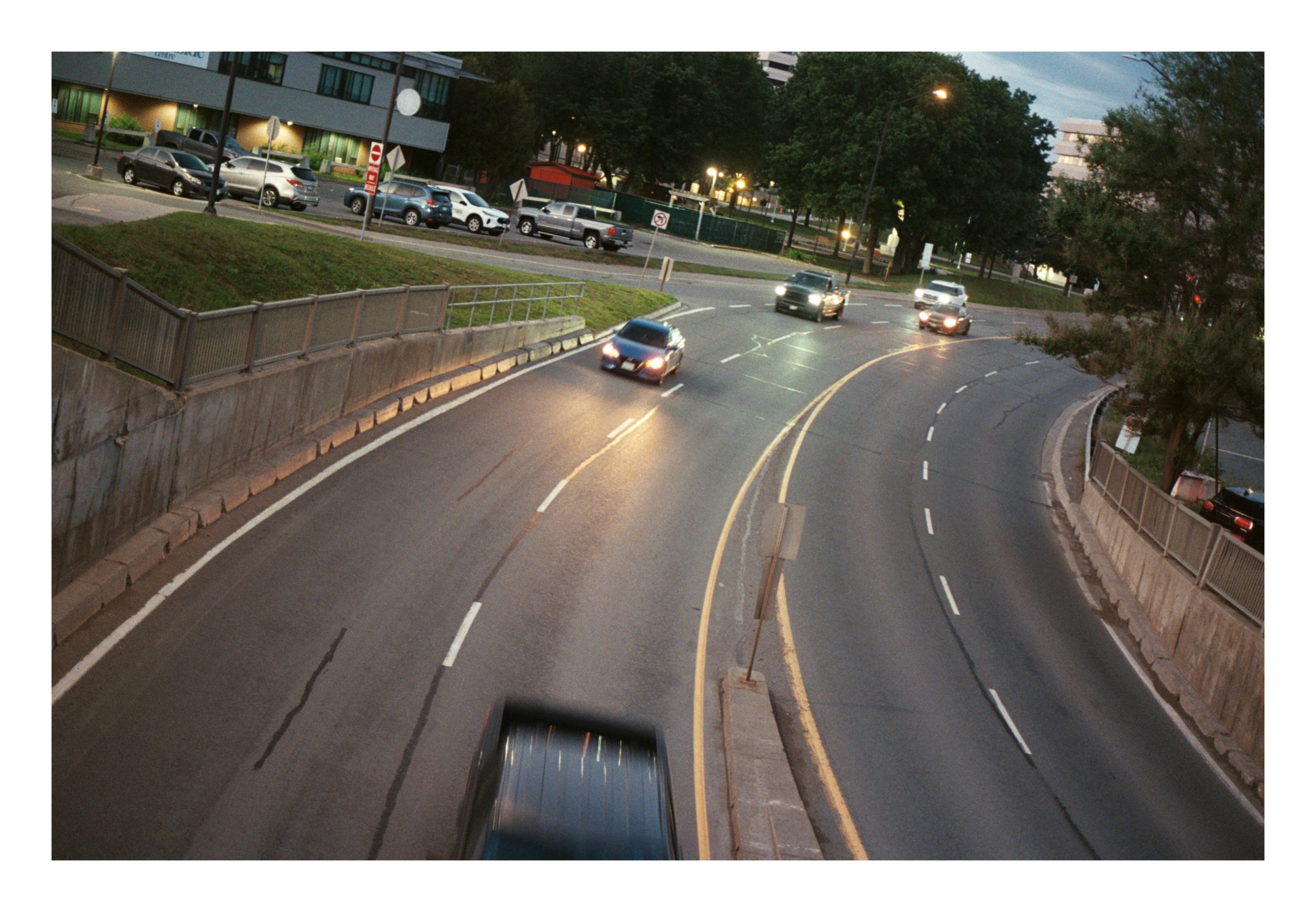 Road with headlights at dusk