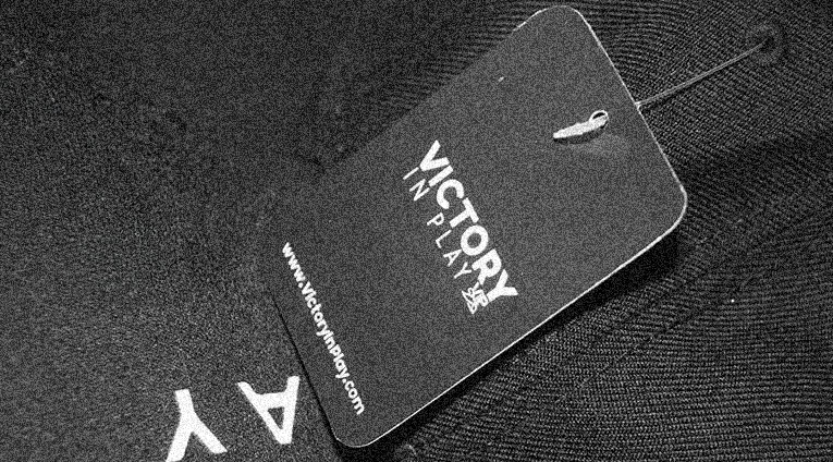 Victory In Play clothing tag
